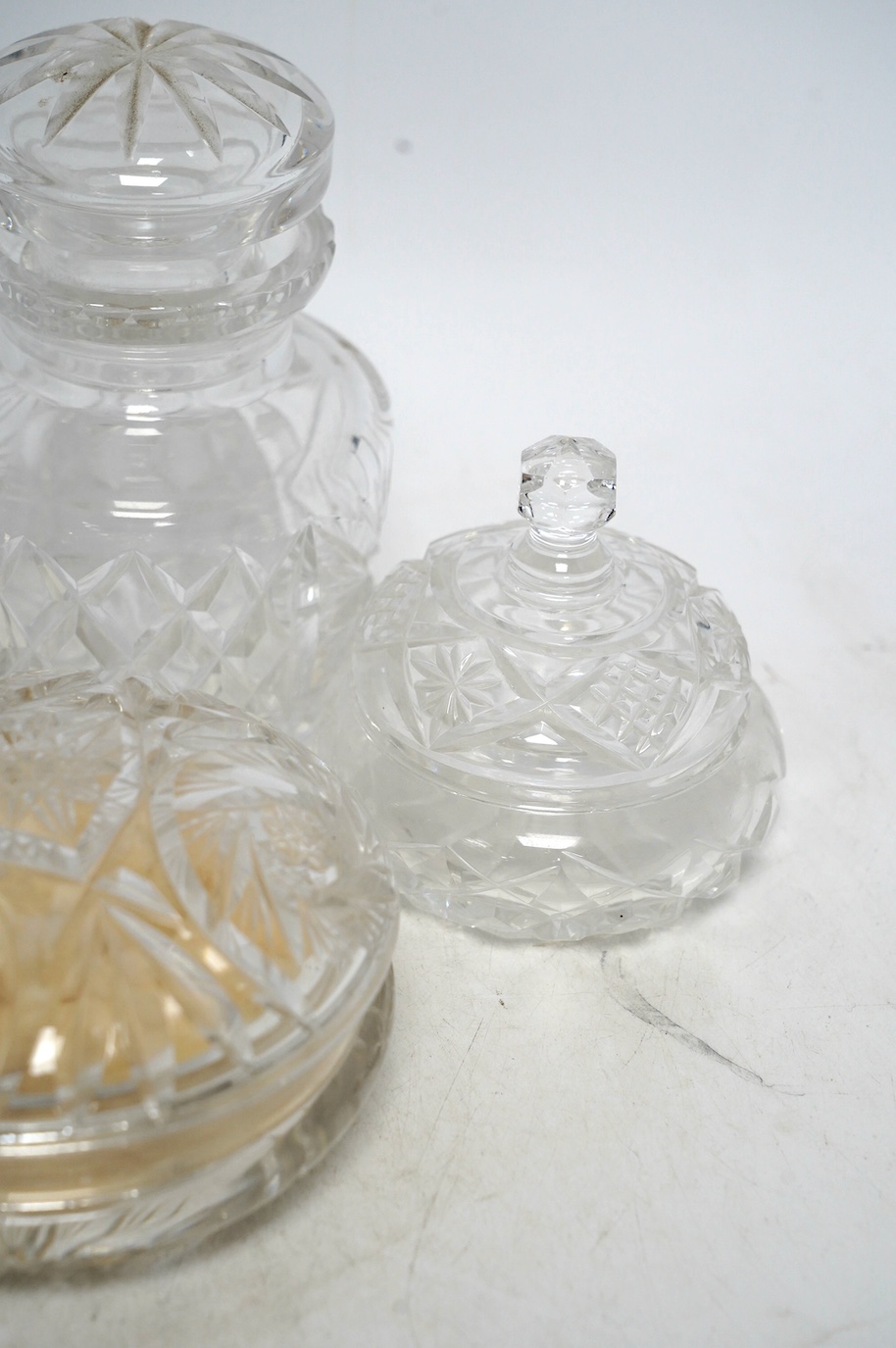 Six cut glass dressing table bottles and bowls, including a bottle with an 800 standard, large white metal cover, 800 standard bottle 16cm high. Condition - fair to good